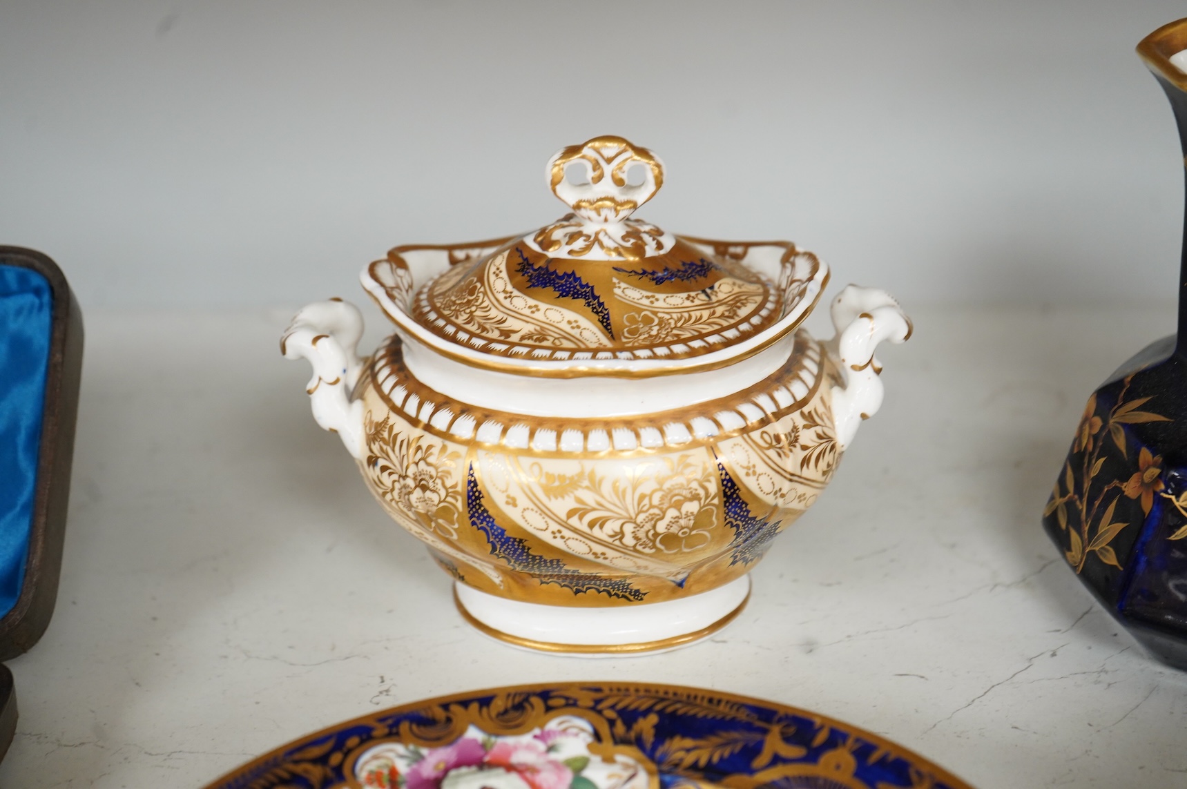 A Group of early 19th century English porcelain; to sauce tureens and covers, one with stand, a covered sugar bowl, a two handled vase, a pot pourri vase and cover, a milk jug and a hydra shaped jug, largest 16cm high